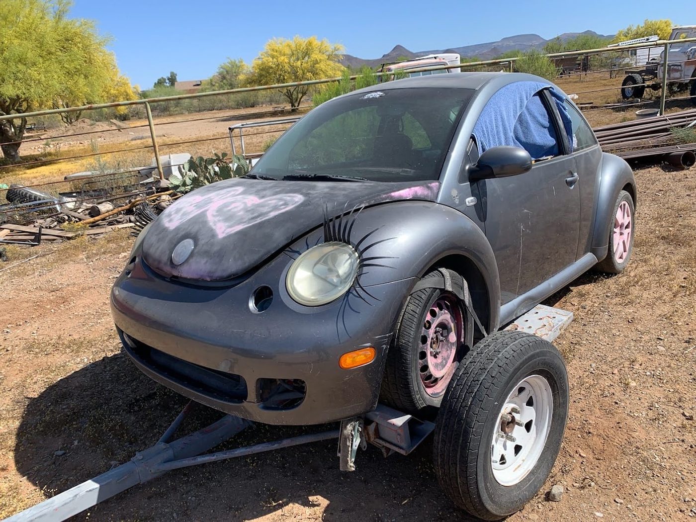 Non-running car loaded on a tow trailer by Luca's Cash For Cars in the Phoenix, Arizona area